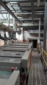 Automatic line for the application of galvanic zinc on steel parts on hinges.
